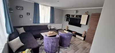 a living room with a couch and a table at Stoykite view in Stoykite