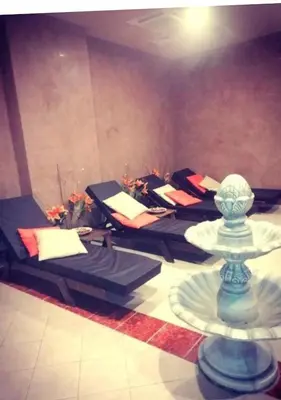 a room with a row of massage chairs in a room at Аспен голф ризорт F204 in Razlog