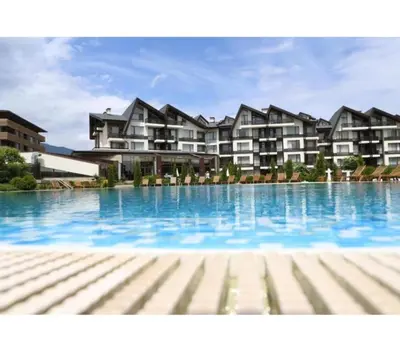 a large swimming pool in front of a building at Аспен голф ризорт F204 in Razlog