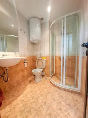 a bathroom with a toilet and a sink and a shower at Nevena 206 B&P in Bansko