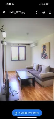 a living room with a couch and a coffee table at Nevena 206 B&P in Bansko