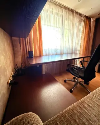 an office with a desk and chairs and a window at Apart Burel 56 in Sofia