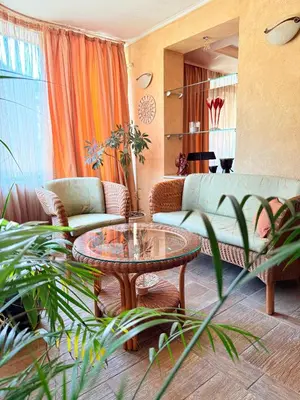 a living room with a couch and a table at Apart Burel 56 in Sofia