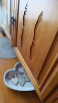 a close up of a wooden door with hearts on it at Родопско сърце in Chepelare