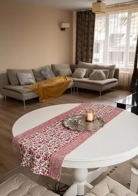 a living room with a table and a couch at Paradise Nest in Sofia