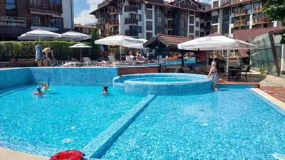 a group of people in a swimming pool at Belvedere 2bedroom private apartment in Bansko