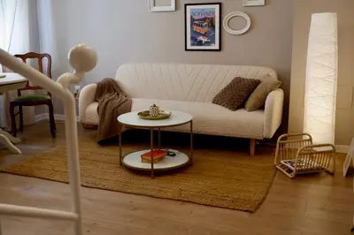 a living room with a couch and a table at Hidden Courtyard Gem - House in Sofia Center in Sofia