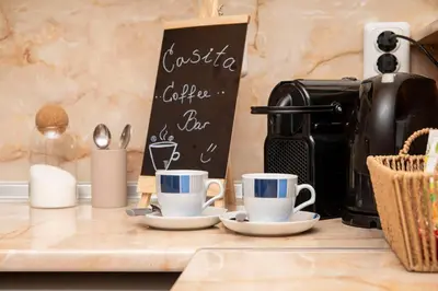 a counter with two cups and a coffee maker at Casita Central - FREE Private Parking & Metro station in Sofia