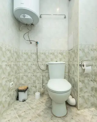 a bathroom with a toilet and a shower in it at Casita Central - FREE Private Parking & Metro station in Sofia