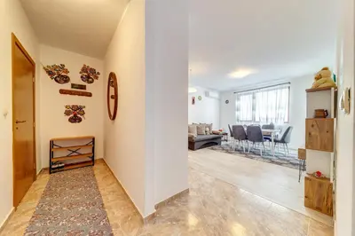 a hallway with a living room and a dining room at Villa Cometa Pamporovo - 1BD Near Slope #7 by Flat Manаger in Pamporovo