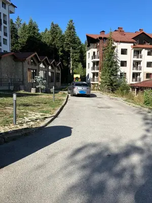 a car parked on the side of a street at Borovets Gardens apartment C-43 in Borovets