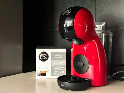 a red mixer sitting on a counter next to a box at Modern 2BD Flat in Central Sofia with Workspace by Flat Mаnager in Sofia