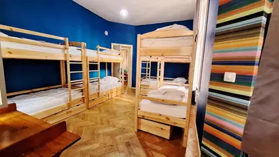 a room with three bunk beds in a room at Key Hostel Vitosha in Sofia