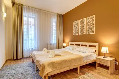 a bedroom with a bed and a large window at Cosy1BD Apt with a Free Parking and Balcony - Grand Resort Pamporovo by Flat Manаger in Pamporovo