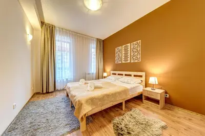 a bedroom with a bed and a large window at Cosy1BD Apt with a Free Parking and Balcony - Grand Resort Pamporovo by Flat Manаger in Pamporovo