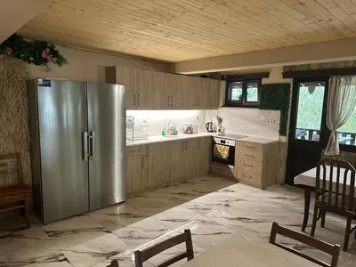 a kitchen with a stainless steel refrigerator in it at Къща за гости Лясково in Lyaskovo