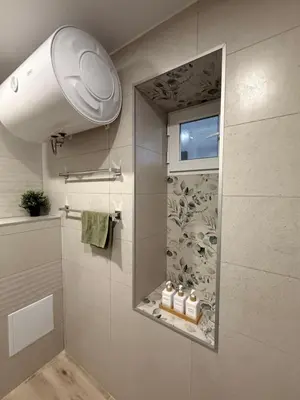 a bathroom with a shower with a mirror at Нощувки 
