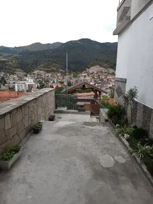 a balcony of a building with a view of a city at Нощувки 