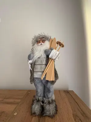 a stuffed animal holding a skateboard on a wooden floor at Pine forest apartments in Pamporovo