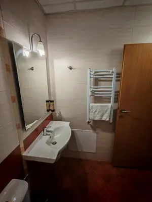 a bathroom with a sink and a mirror at Pine forest apartments in Pamporovo