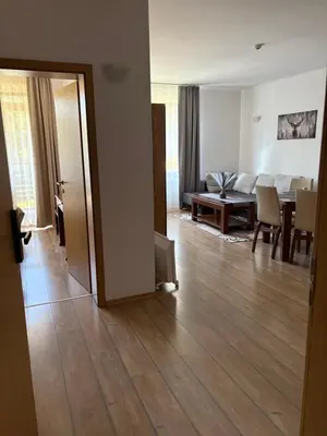 a room with a living room and a dining room at Pine forest apartments in Pamporovo