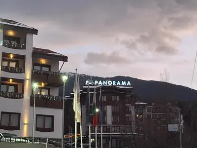 a building with a sign on top of it at Илен C411 Panorama Resort Bansko in Bansko