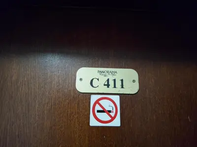 a sign on a wooden table with a no parking sign at Илен C411 Panorama Resort Bansko in Bansko