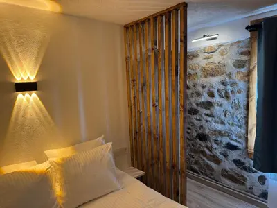 a bedroom with a bed with a lamp on it at Cozy Home in Ardino 2 in Ardino