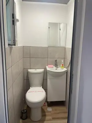 a bathroom with a toilet and a sink at Studio Elias in Zlatograd