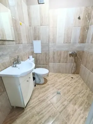 a bathroom with a sink and a toilet at Mladost the City of Fountains Vitosha View in Sofia