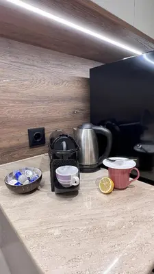 a counter top with some dishes and a tea kettle at 3 Спални - Електрическо Подово Отопление - Бърз WiFi - Веранда - В Гората - Warm Forest Nest Pamporovo in Pamporovo