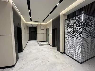 a hallway of a building with a tile floor at Modern & Quiet 1BR Near Center by Flat Mаnager in Sofia