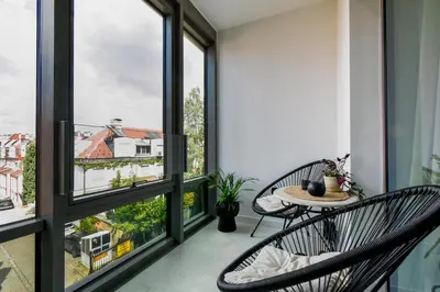 a balcony with two chairs and a table at Modern & Quiet 1BR Near Center by Flat Mаnager in Sofia