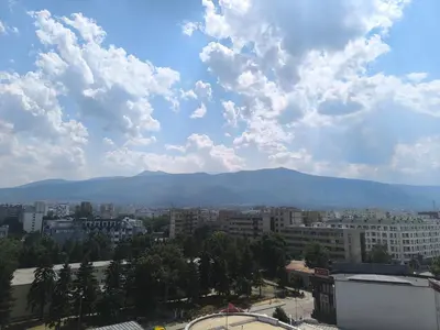 a view of a city with mountains in the background at Sunny Hollow in Sofia