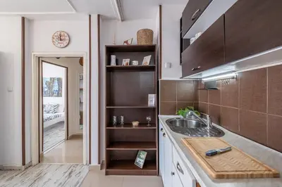 a kitchen with a sink and a counter top at Cozy Studio in Sofia