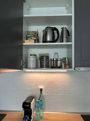 a kitchen with a coffee maker in a cupboard at Cozy&Quiet l 1BD l Free Parking in Sofia