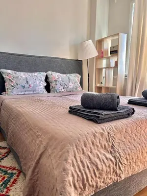a bed with two pillows on top of it at Cozy&Quiet l 1BD l Free Parking in Sofia