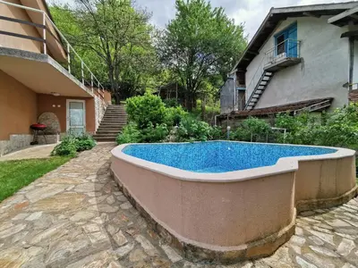 a large swimming pool in the backyard of a house at Villa Aqua in Pravets