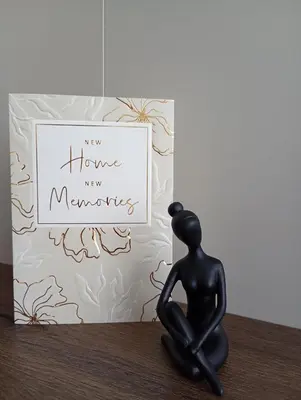 a figurine of a person sitting on a table next to a new home new at Light View Apartment - New Center in Sofia