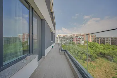 a balcony of a building with a view of a city at NOAR - Free parking - Metro access in Sofia