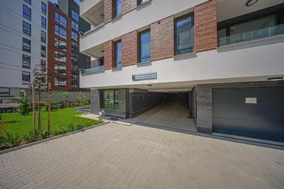 a large building with a driveway in front of it at NOAR - Free parking - Metro access in Sofia
