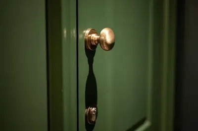 a door with a gold door knob with a black tie at Private Premium Apartment in Plovdiv in Plovdiv