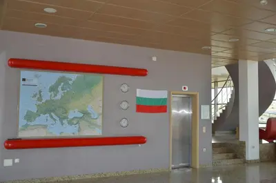 a wall with a map and a red pole on a wall at Хотел Летище Лесново in Ormanliya