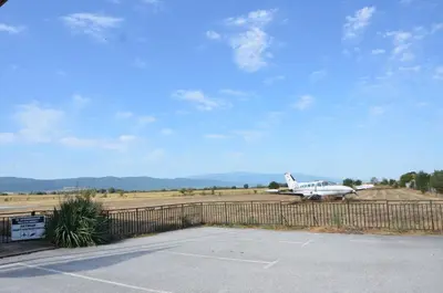 a plane is parked on the runway at an airport at Хотел Летище Лесново in Ormanliya