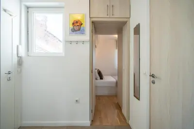 a hallway leading to a bedroom in a house at SOFIA41 - Prime Location in Sofia