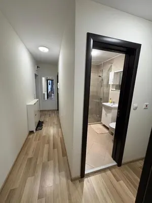 a bathroom with a toilet and a sink and a mirror at Nikea apart 2 in Velingrad