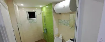 a bathroom with a shower and a toilet at Spacious&Cousy 3 bedroom apartment in Plovdiv