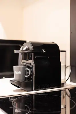 a toaster sitting on a counter with a coffee cup at Casa Desideria 2BAD 2BATH, PARKING , Vitosha Blvd in Sofia
