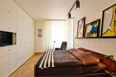 a bedroom with a large bed and a television at Casa Desideria 2BAD 2BATH, PARKING , Vitosha Blvd in Sofia