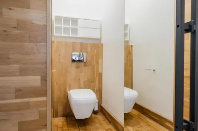 a bathroom with a toilet and a sink at Casa Desideria 2BAD 2BATH, PARKING , Vitosha Blvd in Sofia